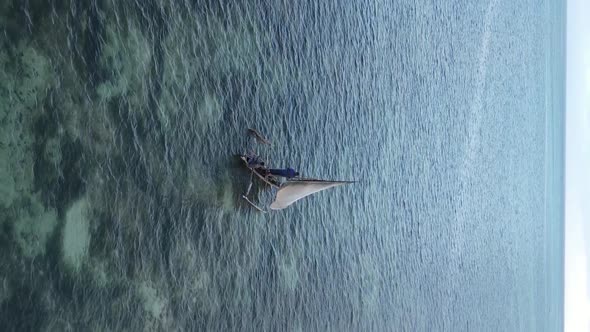 Tanzania Vertical Video  Boat Boats in the Ocean Near the Coast of Zanzibar Aerial View