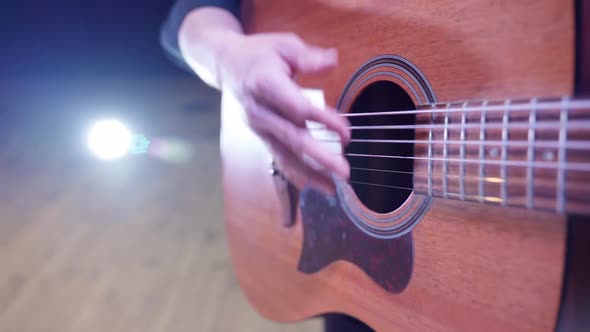 Man Playing Guitar on Stage