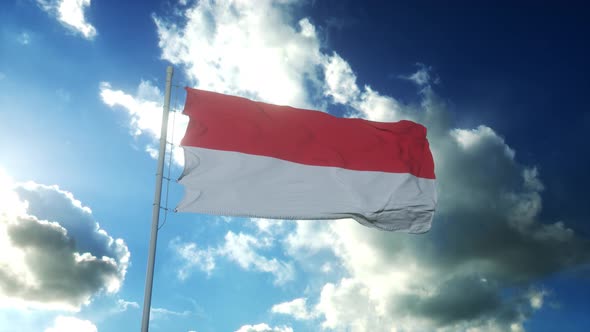 Flag of Indonesia Waving at Wind Against Beautiful Blue Sky