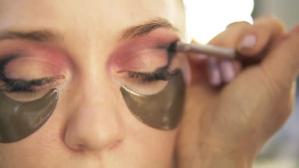 Makeup Artist Put on Shadows on a Eyelid