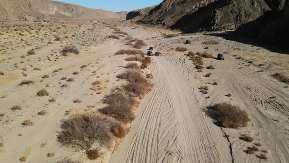 Off-road traffic jam in the desert as vehicles pass each other in Afton Canyon, Mojave Desert, Calif