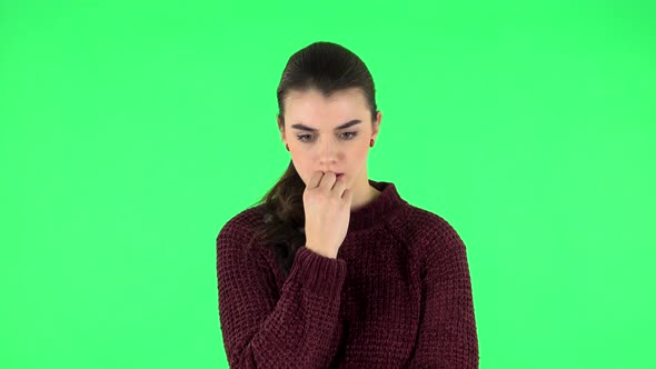 Young Girl Thinks About Something. Green Screen