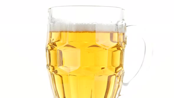 glass of beer isolated on white background, rotate