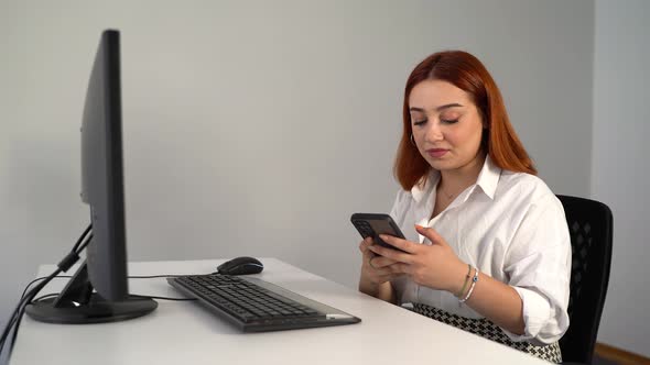 Woman Texting While Working on Computer in Office 4K