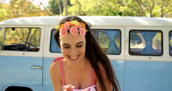 A hipster woman watching her smartphone and laughing