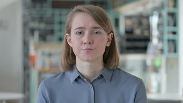 Sad Young Woman Crying Towards the Camera