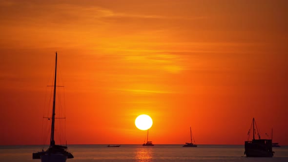 Sail boat in tropical sea at beautiful sunset