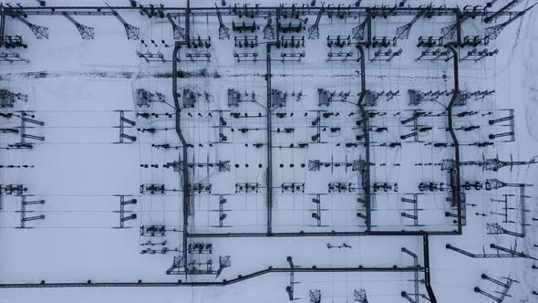 Aerial view of a high voltage electrical substation in winter season.