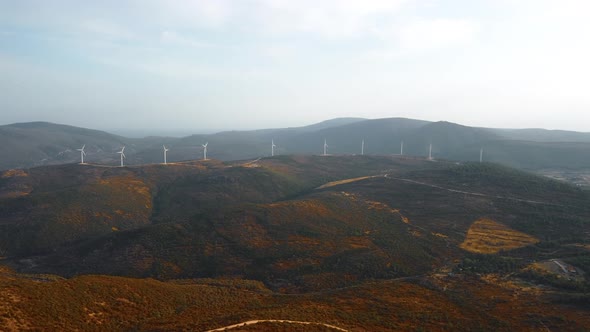 Drone Flies Over a Windmill Park