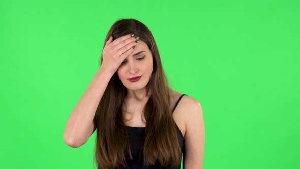 Girl Got a Cold, Sore Throat and Head, Cough on Green Screen at Studio. Green Screen
