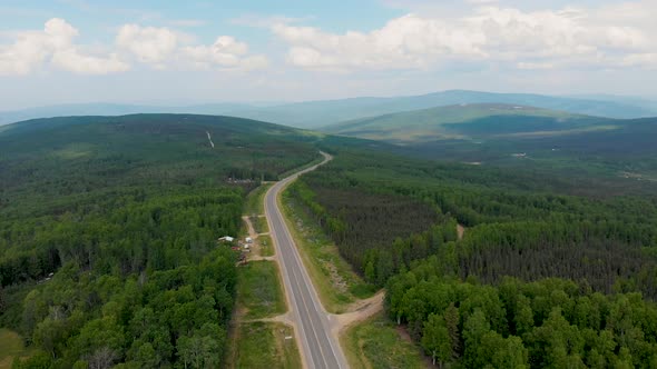 4K Drone Video of Elliott Highway through White Mountains near Fox, Alaska on Summer Day