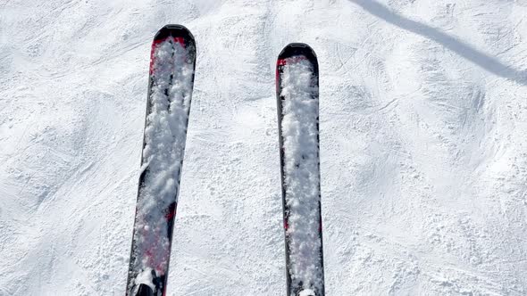 Above From Ski Lift Pair of Skis View Dangling Over Track