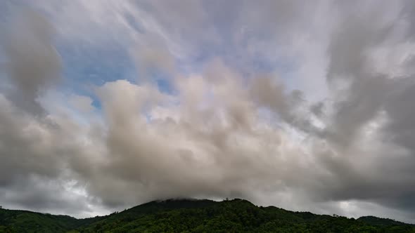 Timelapse Dark sky and black cloud. Black clouds moving fast in Dramatic sky over mountains