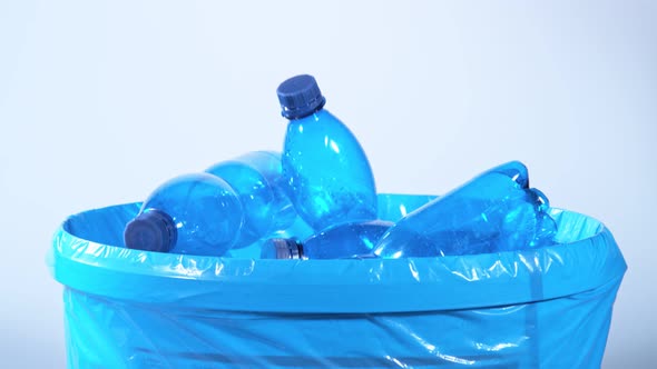 Super Slow Motion Shot of Empty Plastic Bottles Falling Into Trash Can at 1000Fps