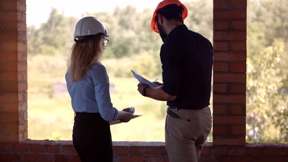 Real Estate Engineer In Hard Hat.Foreman Developer Checking Construction.Architect In Hardhat Helmet
