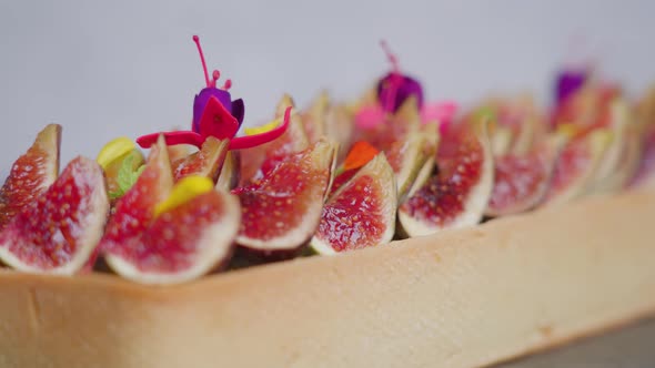 Tasty Biscuit with Fig Slices Flowers and Yellow Elements