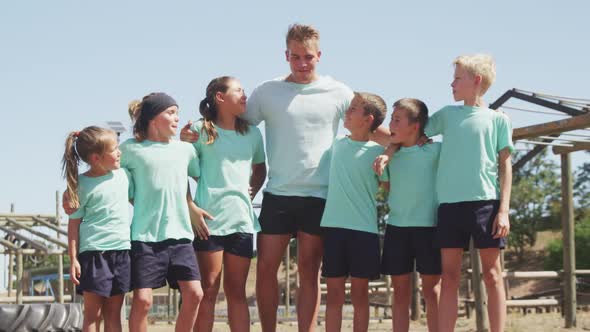 Group of Caucasian boys and girls at boot camp together