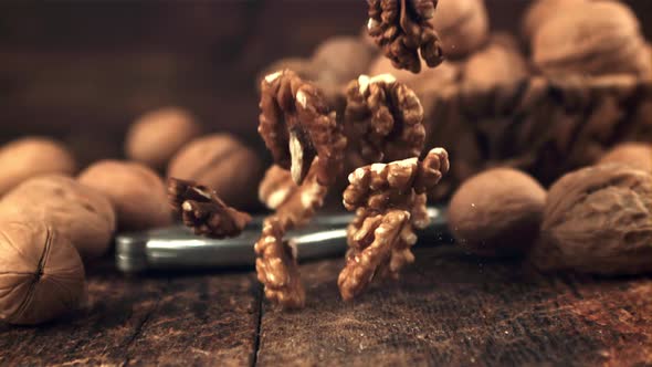 Super Slow Motion Peeled Walnut Falls on the Table