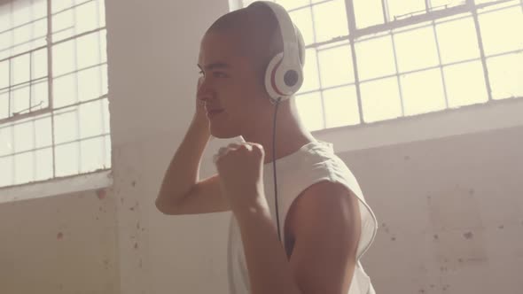 Fashionable young man in an abandoned warehouse