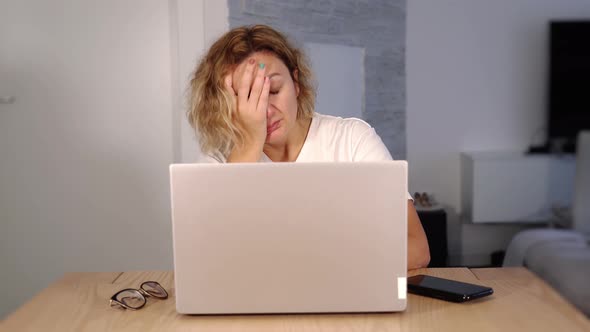 Exhausted Lady Falls Asleep on White Laptop and Wakes Up