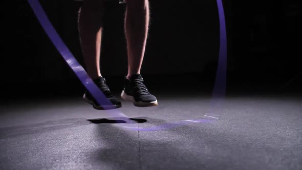 Closeup of Legs Jumping Over the Rope