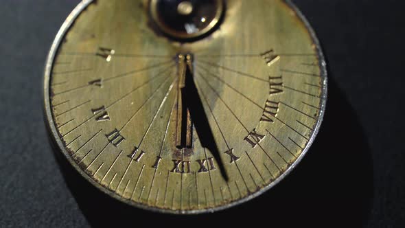 Solar Vintage Clock. Black Background. Close Up