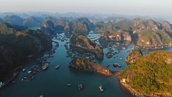 Aerial: sunset clear sky at Cat Ba island and beach with new tourist resort, Halong bay Vietnam