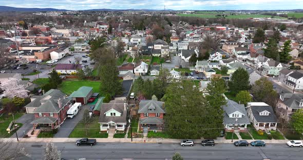 Small town America bucolic setting. Aerial truck shot of traditional old fashioned homes in USA town