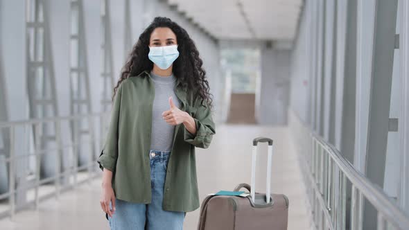 Hispanic Young Girl Traveler Woman Wears Face Protective Medical Mask Stands at Airport Terminal