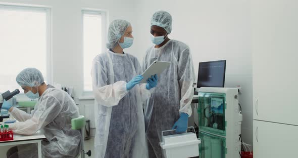 A Team of Laboratory Technicians Work in a Modern Wellequipped Laboratory