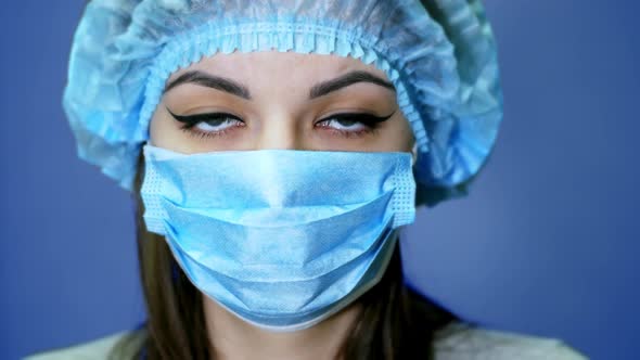 Portrait of a Female Medical Worker, Removes the Mask