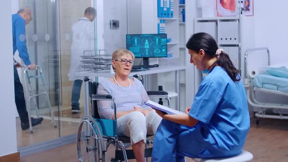 Elderly Patient with Walking Disabilities in Wheelchair