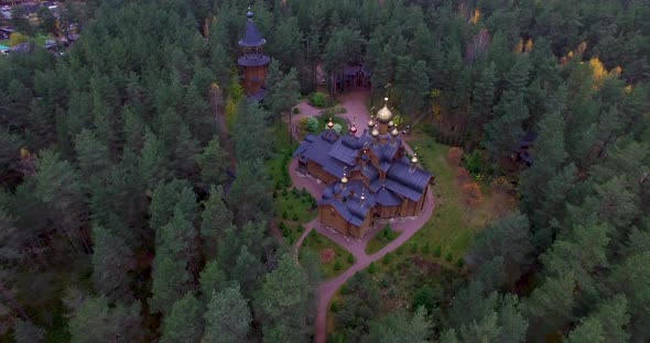 Orthodox Church with Golden Domes in the Middle of the Forest