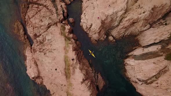 Kayaking between mediterranean cliffs