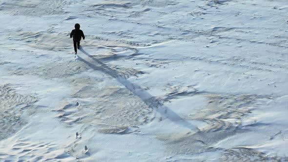 Human Walk Throw the Snowfield