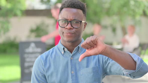 Portrait of Thumbs Down Gesture By African Man