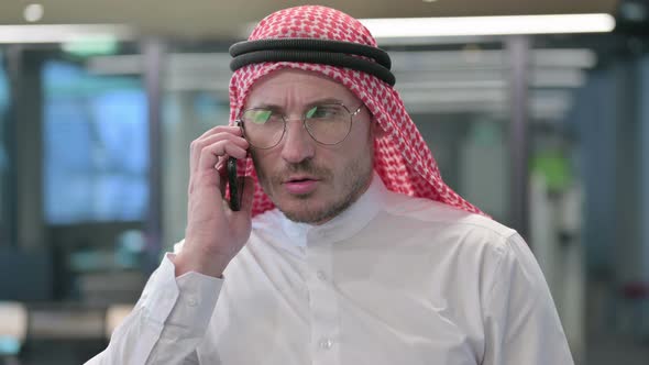 Aggressive Middle Aged Arab Man Angry on Smartphone
