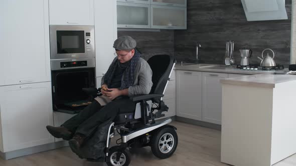 Man in Wheelchair Enjoying Fresh Cookies