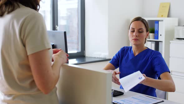 Doctor and Patient with Prescription at Hospital