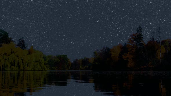 the night sky is reflected in the autumn lake