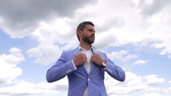 Mature Handsome Businessman Wearing Jacket and Checking Time on Wristwatch Meeting