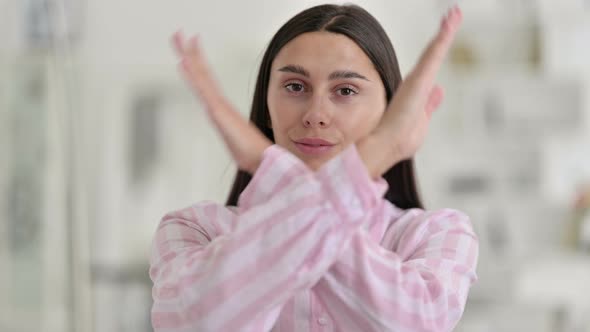 Angry Young Latin Woman Saying No By Arms Crossed