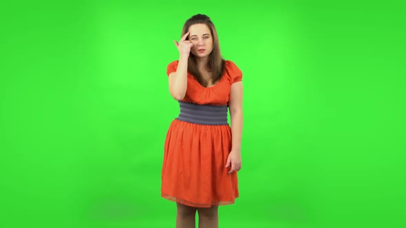 Angry Girl Is Waving Her Hands in Indignation, Shrugs. Green Screen