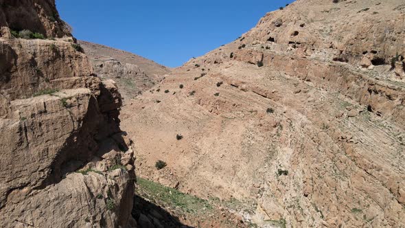 Aerial Drone Shot of Dry Valley and Mountains at Binyamin Region in Blue Sky Judea and Samaria Area