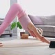 Woman Practicing Yoga Poses Stretching in Front of Tablet Laptop at Home Blogger Teacher Yoga Online - VideoHive Item for Sale