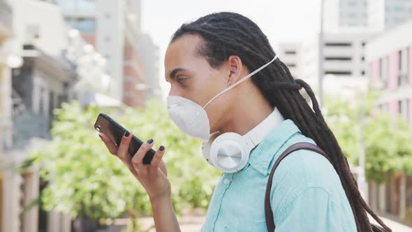 Man with a coronavirus mask talking on the phone