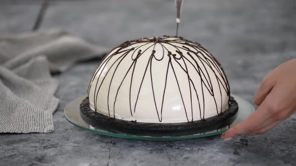 Pouring Melted Chocolate on Top of a Cake. Pancho Cake with Pineapple and Sour Cream Topped with