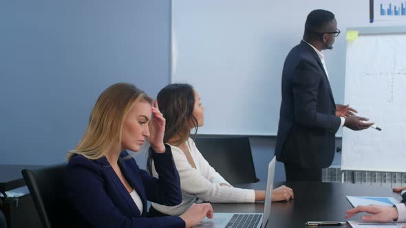 Successful Team Leader and Business Owner Leading Business Meeting