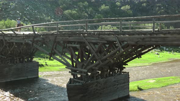 Timber Wooden Bridge Made of Tree Logs