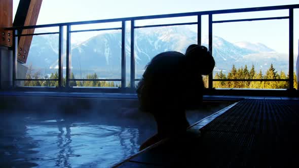 Couple relaxing in swimming pool